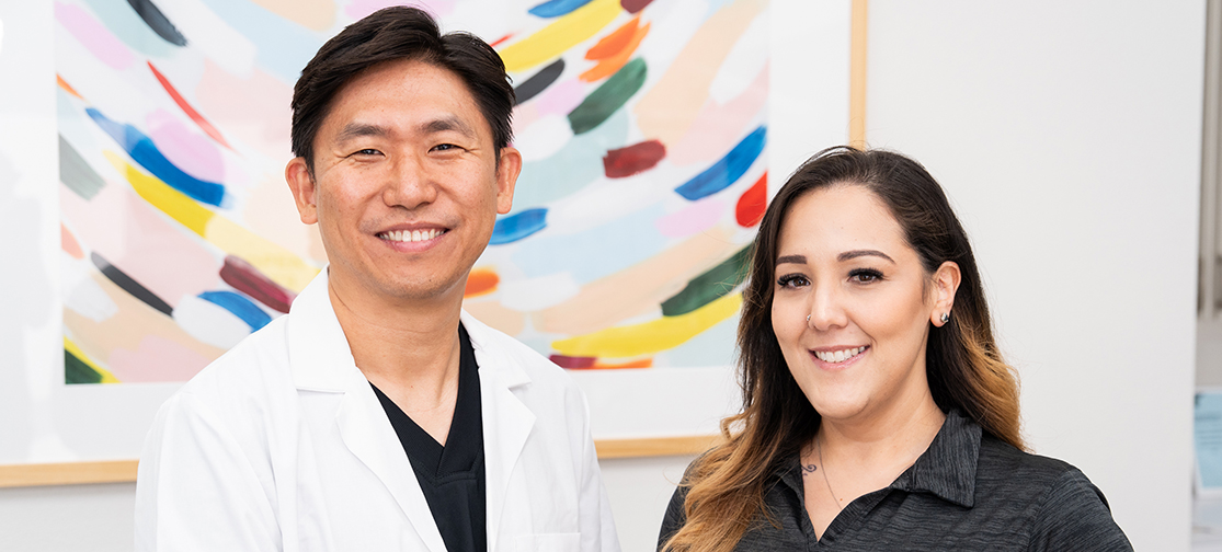 Dr. Lee smiling with the office coordinator at Just For Kids Dentistry