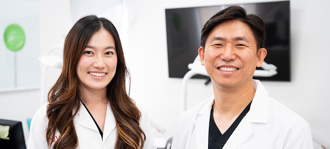 Dr. Lu and Dr. Lee smiling together at Just For Kids Dentistry